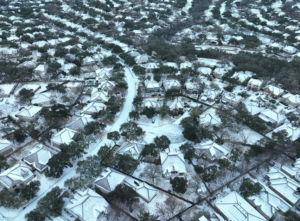 Snow-covered suburban neighborhood aerial view in Austin texas