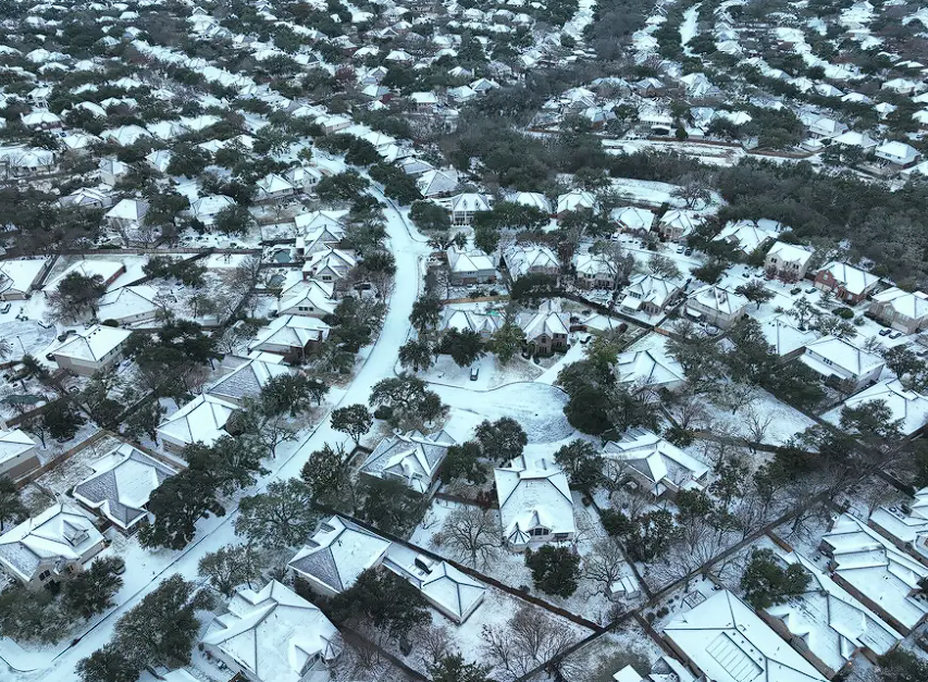 Snow-covered suburban neighborhood aerial view in Austin texas