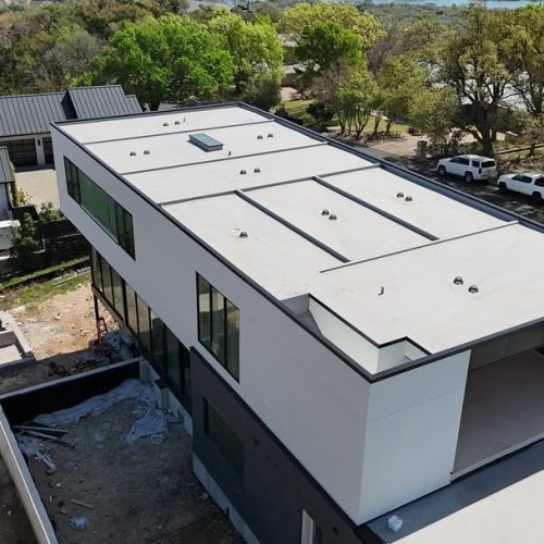 Modern flat-roofed house under construction